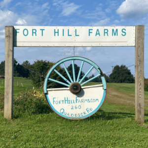 Wagon Wheel sign with Fort Hill Farms name